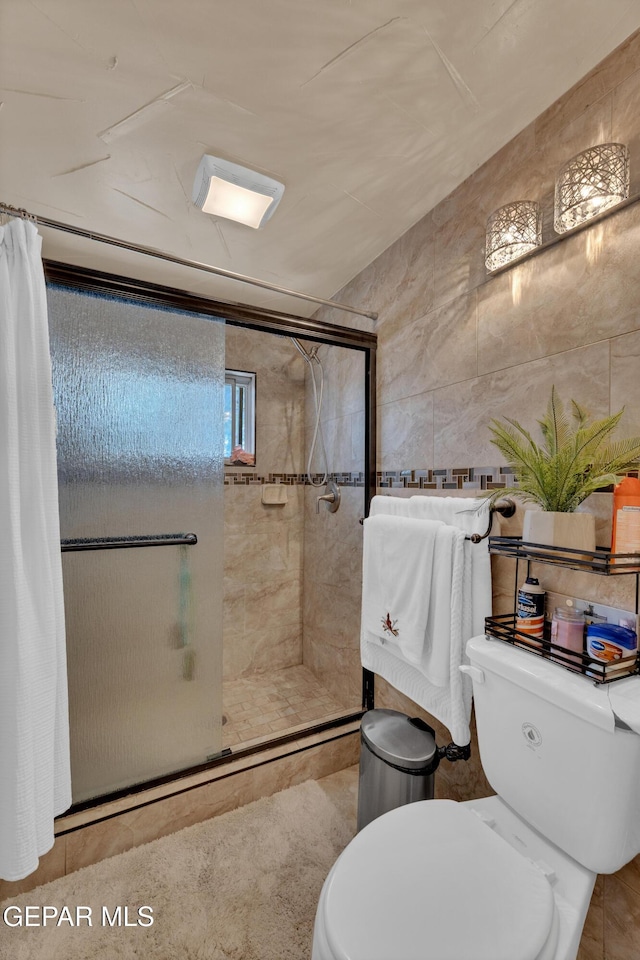 11749 Socorro Rd, Socorro, TX 79927 - full bath with tile walls and a stall shower