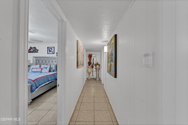 11749 Socorro Rd, Socorro, TX 79927 - hall with a textured ceiling and light tile patterned floors