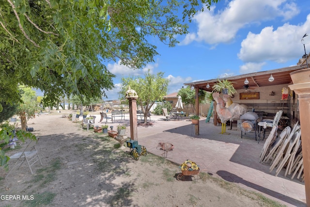 11749 Socorro Rd, Socorro, TX 79927 - view of home's community with a patio