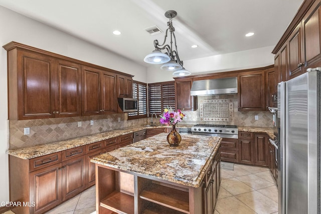41 Sun Point Ln, El Paso, TX 79912 - kitchen with appliances with stainless steel finishes, wall chimney exhaust hood, open shelves, light tile patterned floors, and tasteful backsplash