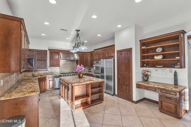41 Sun Point Ln, El Paso, TX 79912 - kitchen featuring open shelves, stainless steel appliances, wall chimney range hood, backsplash, and light stone counters