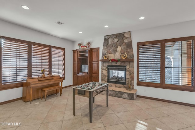 41 Sun Point Ln, El Paso, TX 79912 - recreation room featuring a stone fireplace, recessed lighting, and light tile patterned flooring