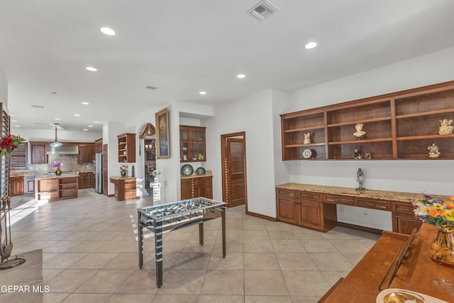 41 Sun Point Ln, El Paso, TX 79912 - recreation room with recessed lighting, built in study area, and light tile patterned floors
