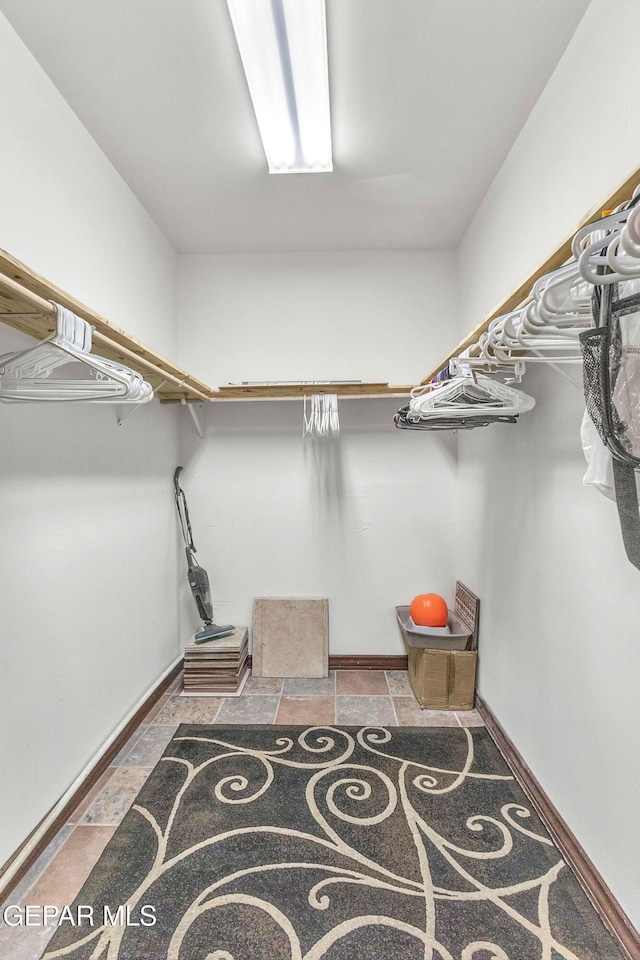 41 Sun Point Ln, El Paso, TX 79912 - spacious closet featuring stone finish floors