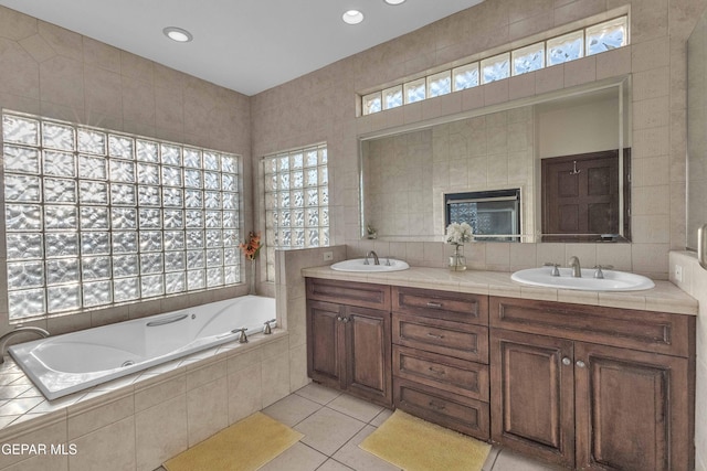 41 Sun Point Ln, El Paso, TX 79912 - bathroom with a whirlpool tub, double vanity, tile patterned floors, and recessed lighting