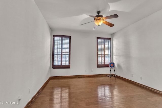 41 Sun Point Ln, El Paso, TX 79912 - empty room with plenty of natural light, wood finished floors, and a ceiling fan