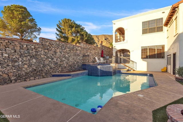 41 Sun Point Ln, El Paso, TX 79912 - view of pool featuring a pool with connected hot tub, a patio area, and a mountain view