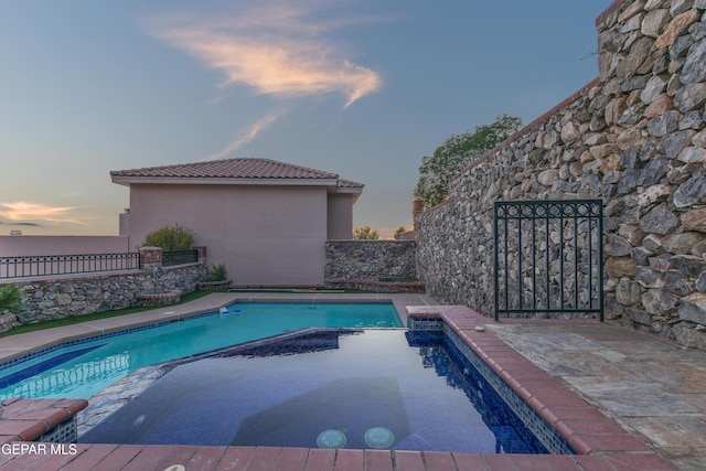 41 Sun Point Ln, El Paso, TX 79912 - view of pool with a pool with connected hot tub and a fenced backyard
