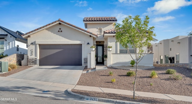 7424 Cimarron Gap Dr, El Paso, TX 79911 - mediterranean / spanish-style home featuring a tile roof, an attached garage, concrete driveway, and stucco siding