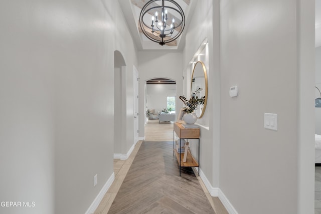 7424 Cimarron Gap Dr, El Paso, TX 79911 - hall with arched walkways and a chandelier