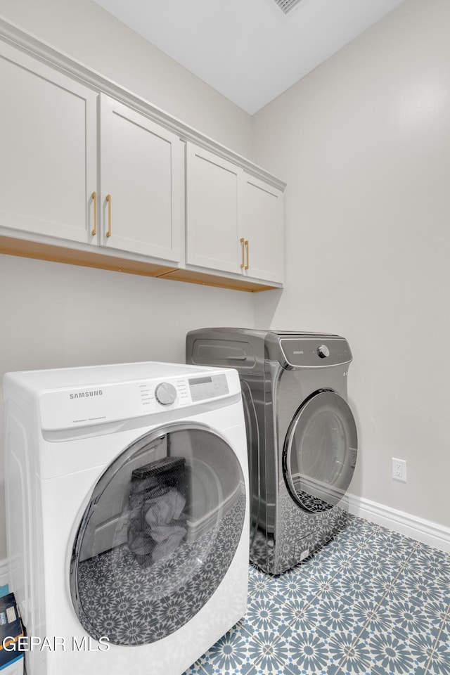 7424 Cimarron Gap Dr, El Paso, TX 79911 - laundry room with cabinet space and independent washer and dryer