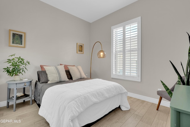 7424 Cimarron Gap Dr, El Paso, TX 79911 - bedroom featuring baseboards and light wood-style flooring