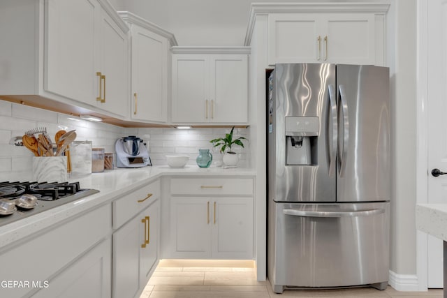 7424 Cimarron Gap Dr, El Paso, TX 79911 - kitchen featuring stainless steel appliances, white cabinets, and backsplash