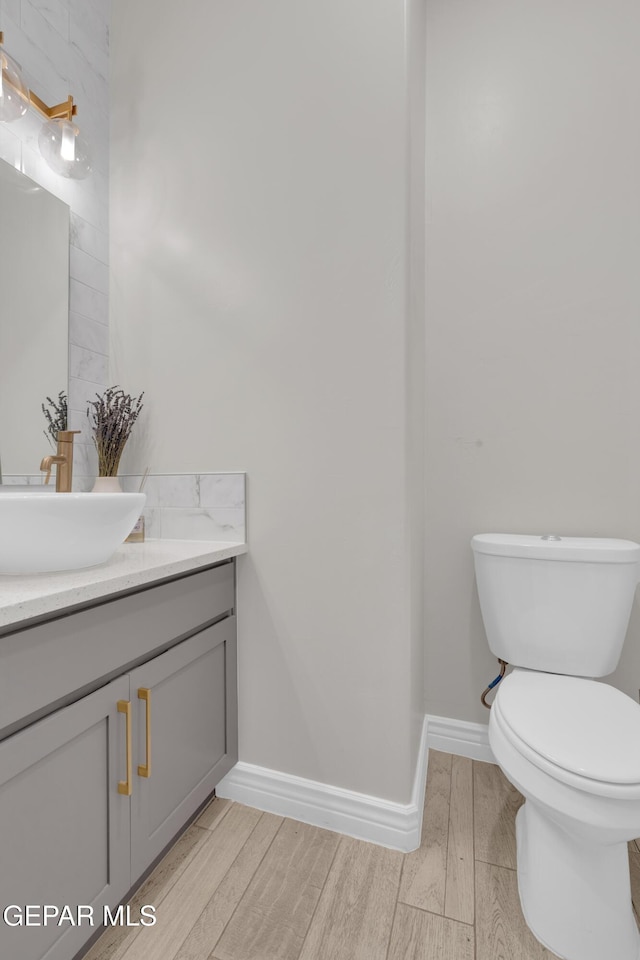 7424 Cimarron Gap Dr, El Paso, TX 79911 - bathroom featuring wood finished floors and vanity
