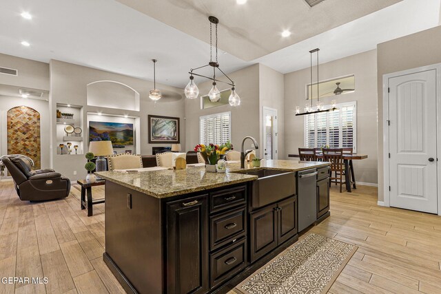 12289 Freshwater Dr, El Paso, TX 79928 - kitchen featuring stainless steel dishwasher, open floor plan, healthy amount of natural light, light wood-type flooring, and recessed lighting