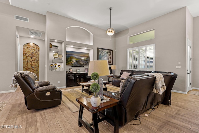 12289 Freshwater Dr, El Paso, TX 79928 - living area featuring light wood finished floors and a high ceiling