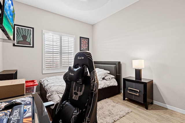 12289 Freshwater Dr, El Paso, TX 79928 - bedroom with wood finished floors and baseboards