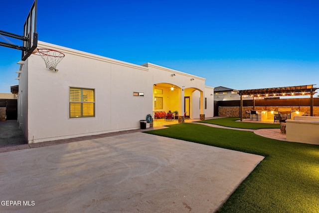 12289 Freshwater Dr, El Paso, TX 79928 - back of property with a lawn, a patio, stucco siding, and a pergola
