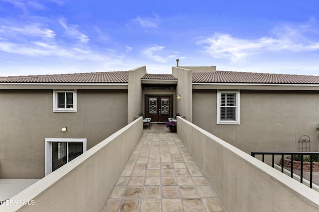 34 Kingery Dr, El Paso, TX 79902 - property entrance with french doors, stucco siding, and a tiled roof