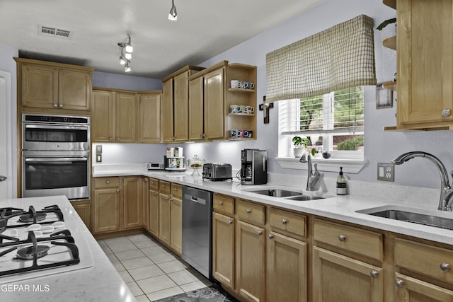 34 Kingery Dr, El Paso, TX 79902 - kitchen featuring stainless steel appliances, light countertops, light tile patterned floors, and open shelves