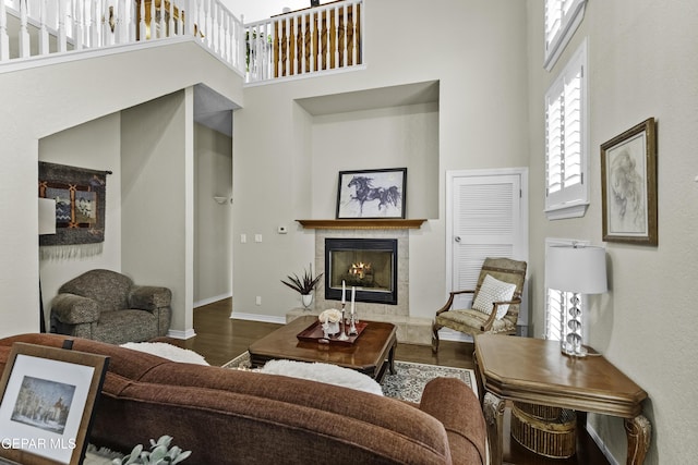 34 Kingery Dr, El Paso, TX 79902 - living room featuring a high ceiling, wood finished floors, and a tiled fireplace