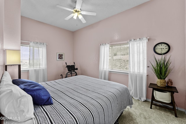 34 Kingery Dr, El Paso, TX 79902 - carpeted bedroom featuring multiple windows and a ceiling fan