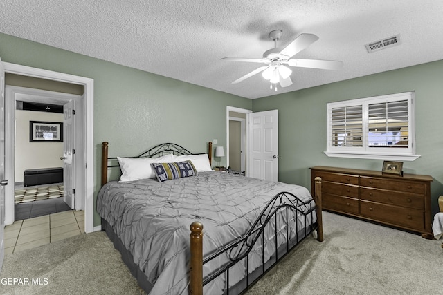 34 Kingery Dr, El Paso, TX 79902 - bedroom with carpet floors, a textured ceiling, and a ceiling fan
