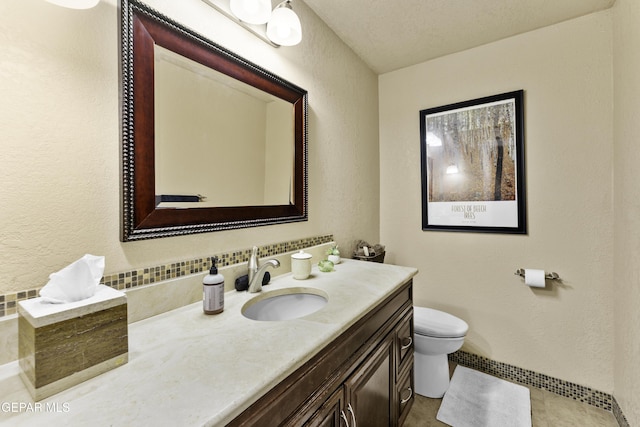 34 Kingery Dr, El Paso, TX 79902 - bathroom featuring vanity and a textured wall