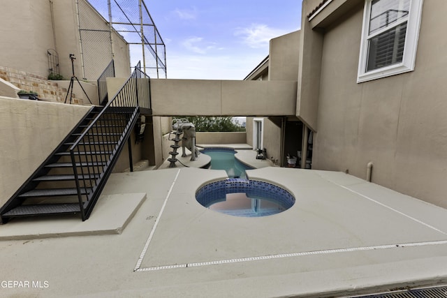 34 Kingery Dr, El Paso, TX 79902 - view of swimming pool featuring stairs, a pool with connected hot tub, a patio area, and a fenced backyard