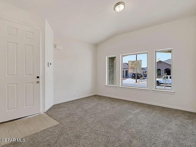 14309 Seth Payne Dr, El Paso, TX 79928 - spare room featuring vaulted ceiling and light colored carpet