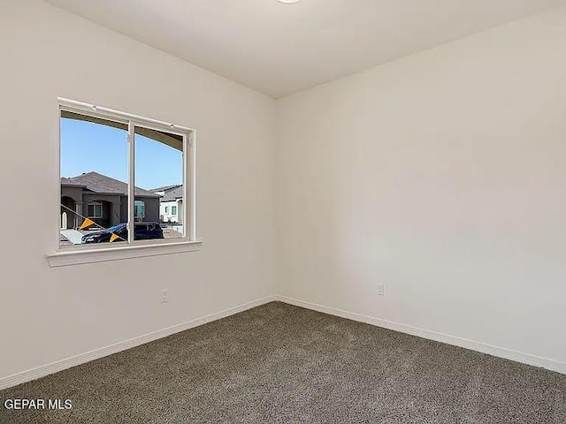 14309 Seth Payne Dr, El Paso, TX 79928 - spare room featuring baseboards and dark colored carpet