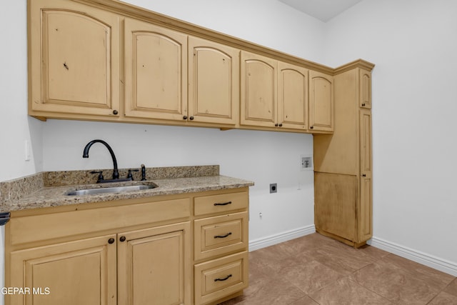 5833 Sundale Rd, El Paso, TX 79912 - laundry area with electric dryer hookup, hookup for a washing machine, and cabinet space