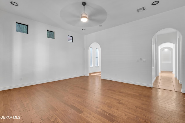 5833 Sundale Rd, El Paso, TX 79912 - unfurnished room with arched walkways, ceiling fan, and light wood finished floors