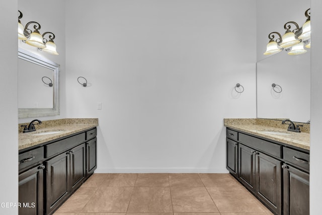 5833 Sundale Rd, El Paso, TX 79912 - full bathroom with two vanities and tile patterned floors