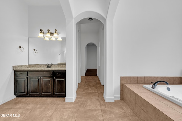 5833 Sundale Rd, El Paso, TX 79912 - full bathroom featuring vanity, a garden tub, and tile patterned floors