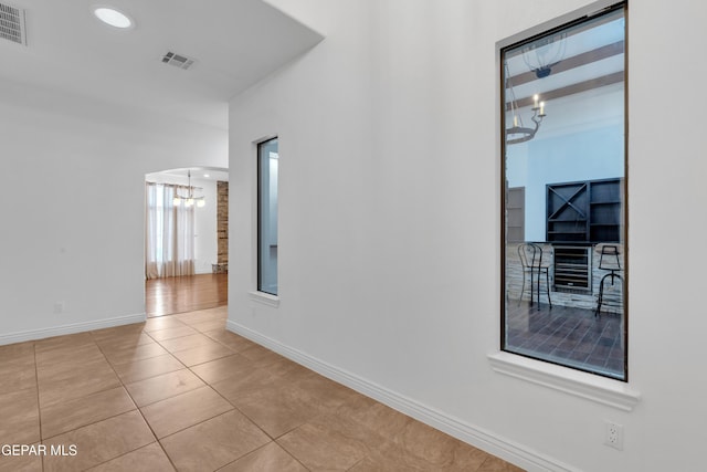 5833 Sundale Rd, El Paso, TX 79912 - spare room with a chandelier and tile patterned floors