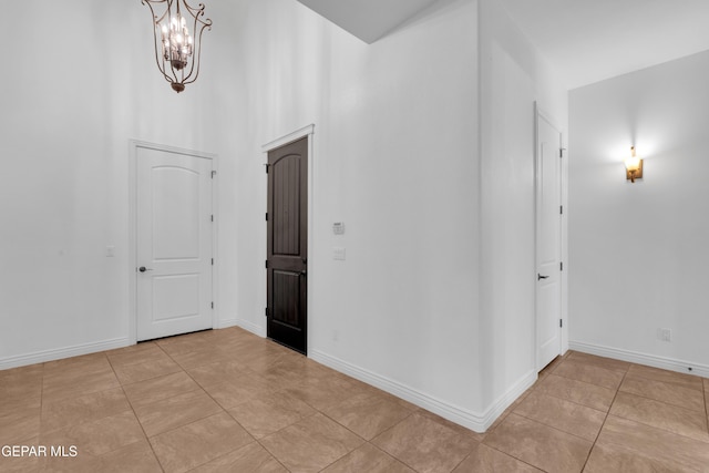 5833 Sundale Rd, El Paso, TX 79912 - foyer featuring light tile patterned floors and a chandelier