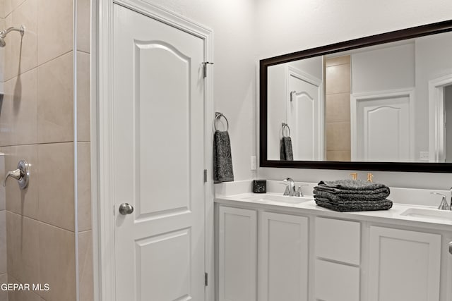 2221 Moon Loft Pl, El Paso, TX 79911 - bathroom with double vanity and a tile shower