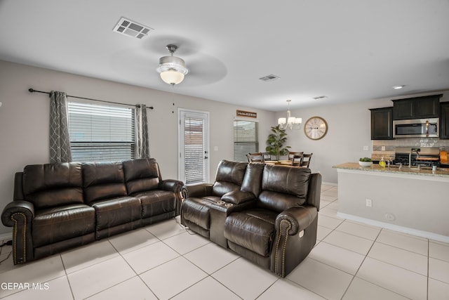 801 Hc Gilbert Minjares Dr Unit A, Socorro, TX 79927 - living area with a chandelier, light tile patterned floors, and a ceiling fan