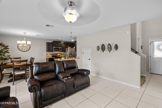 801 Hc Gilbert Minjares Dr Unit A, Socorro, TX 79927 - living area featuring a chandelier, ceiling fan, and light tile patterned floors