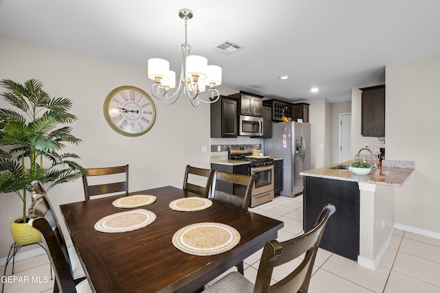 801 Hc Gilbert Minjares Dr Unit A, Socorro, TX 79927 - dining area featuring light tile patterned flooring, a chandelier, and recessed lighting