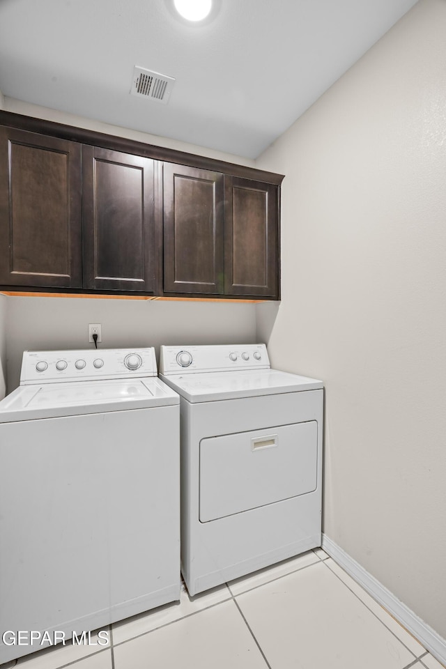 801 Hc Gilbert Minjares Dr Unit A, Socorro, TX 79927 - washroom featuring cabinet space, independent washer and dryer, and light tile patterned floors