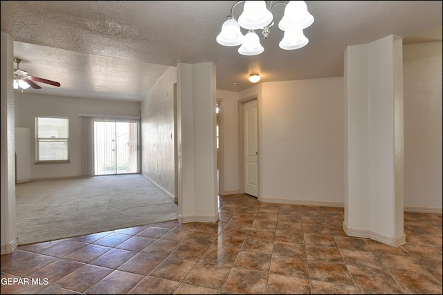 3517 Tierra Bahia Dr, El Paso, TX 79938 - empty room with ceiling fan, a chandelier, carpet flooring, and a textured ceiling