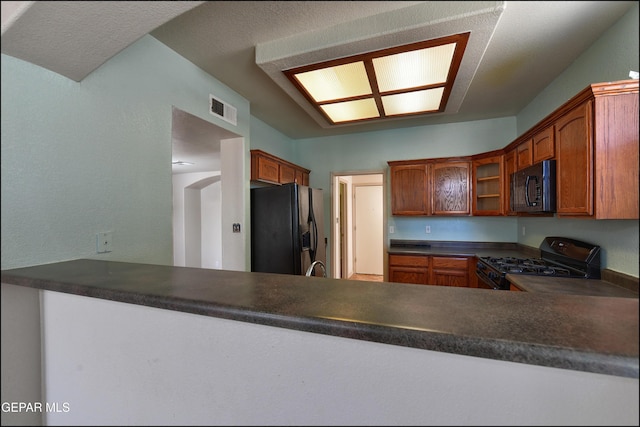 3517 Tierra Bahia Dr, El Paso, TX 79938 - kitchen featuring black appliances, glass insert cabinets, and dark countertops