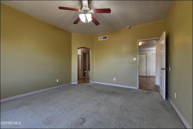3517 Tierra Bahia Dr, El Paso, TX 79938 - unfurnished bedroom featuring arched walkways, carpet, and a ceiling fan
