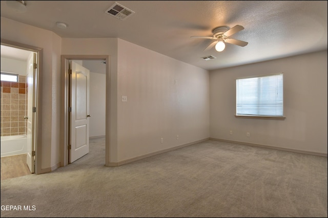 3517 Tierra Bahia Dr, El Paso, TX 79938 - unfurnished room with light carpet, plenty of natural light, ceiling fan, and a smoke detector