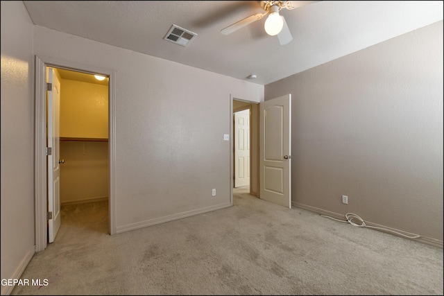 3517 Tierra Bahia Dr, El Paso, TX 79938 - unfurnished bedroom featuring carpet floors, a spacious closet, and ceiling fan