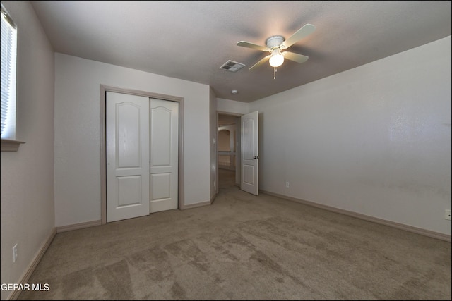 3517 Tierra Bahia Dr, El Paso, TX 79938 - unfurnished bedroom with light colored carpet, a closet, and ceiling fan