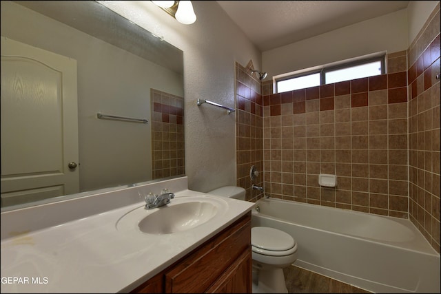 3517 Tierra Bahia Dr, El Paso, TX 79938 - bathroom featuring vanity, tub / shower combination, and wood finished floors