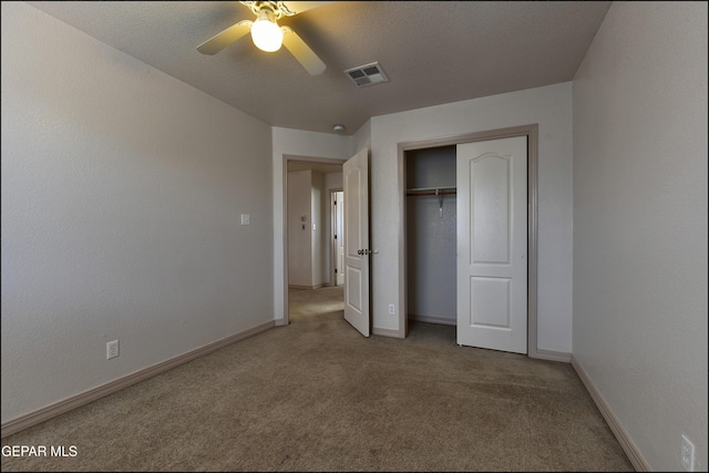 3517 Tierra Bahia Dr, El Paso, TX 79938 - unfurnished bedroom featuring light carpet, a closet, and ceiling fan